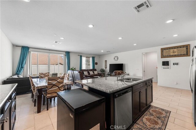 37732 Phelan Ln, Palmdale, CA 93552 - kitchen featuring a sink, stainless steel appliances, light tile patterned floors, recessed lighting, and open floor plan