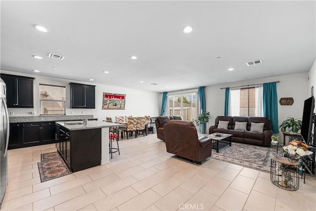 37732 Phelan Ln, Palmdale, CA 93552 - living room featuring recessed lighting and light tile patterned floors
