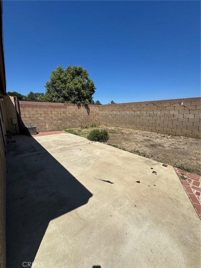 1102 Monroe St, Lake Elsinore, CA 92530 - fenced backyard featuring a patio