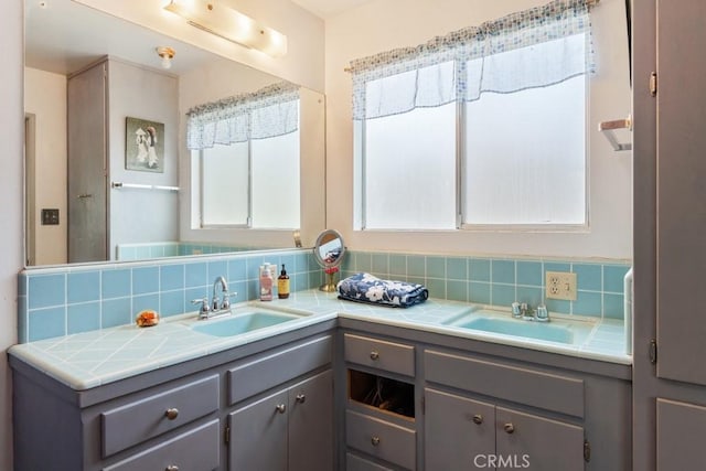 bathroom with backsplash and double vanity