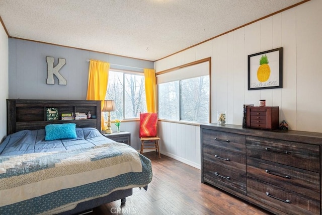 1050 Golden Rule Ln, Lake Arrowhead, CA 92352 - bedroom featuring ornamental molding, a textured ceiling, wood finished floors, and a decorative wall