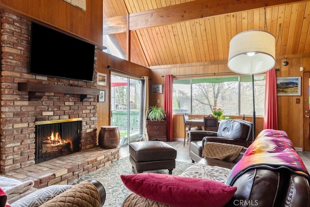 carpeted living area featuring wooden ceiling, a fireplace, and wooden walls