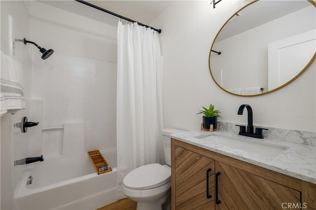 full bath featuring toilet, vanity, and shower / bath combination with curtain