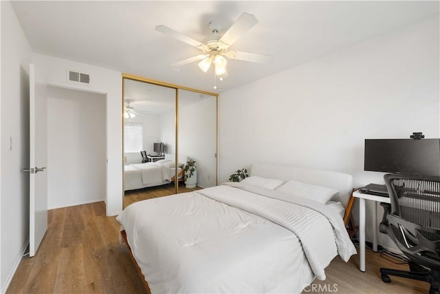 9735 Reseda Blvd Unit 56, Northridge, CA 91324 - bedroom featuring a desk, a closet, wood finished floors, and ceiling fan