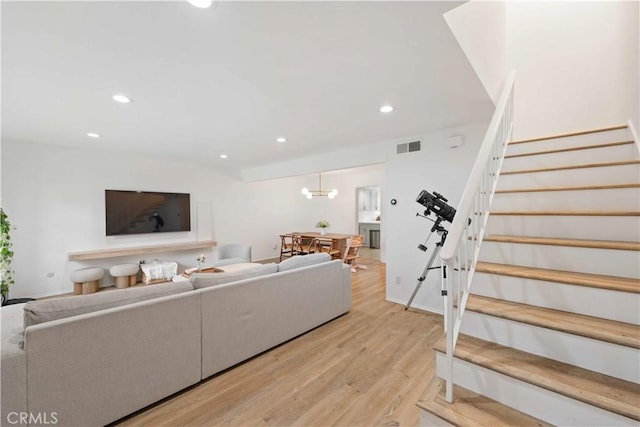 9735 Reseda Blvd Unit 56, Northridge, CA 91324 - living room with light wood-style floors, stairway, recessed lighting, and a chandelier