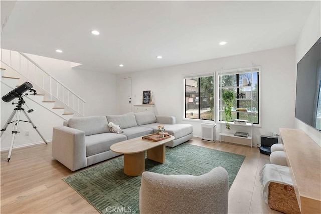 9735 Reseda Blvd Unit 56, Northridge, CA 91324 - living room featuring light wood finished floors, stairs, and recessed lighting
