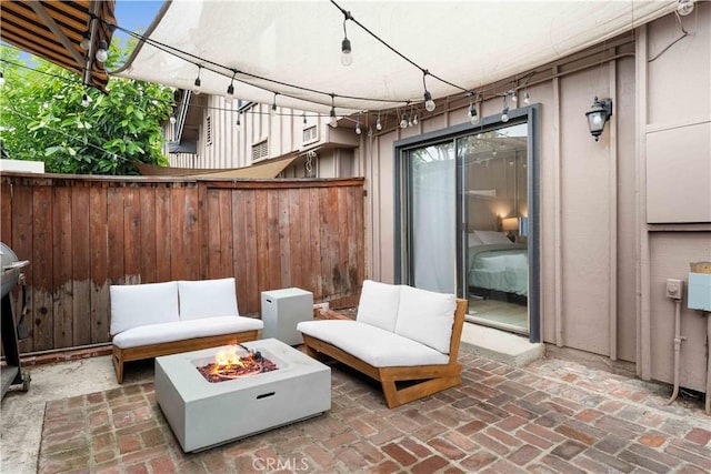 9735 Reseda Blvd Unit 56, Northridge, CA 91324 - view of patio featuring an outdoor fire pit and fence