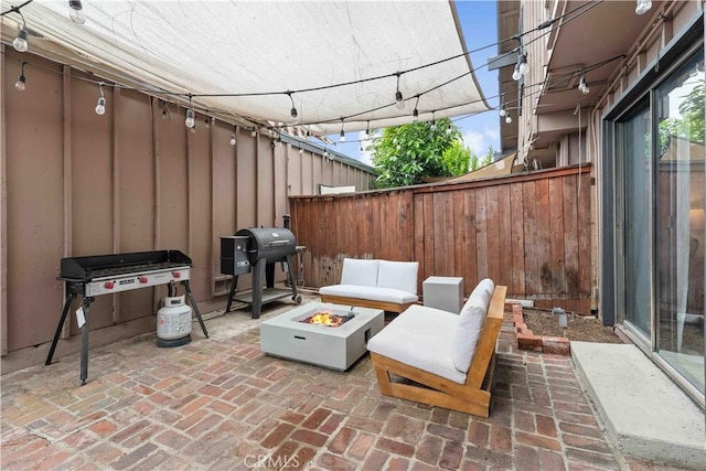 9735 Reseda Blvd Unit 56, Northridge, CA 91324 - view of patio / terrace with an outdoor fire pit, fence, and area for grilling