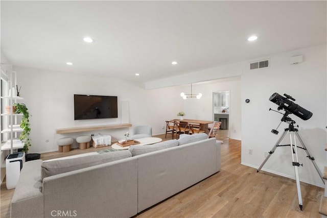 9735 Reseda Blvd Unit 56, Northridge, CA 91324 - living area featuring light wood finished floors and recessed lighting