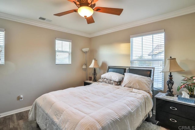 bedroom with wood finished floors, ornamental molding, baseboards, and ceiling fan