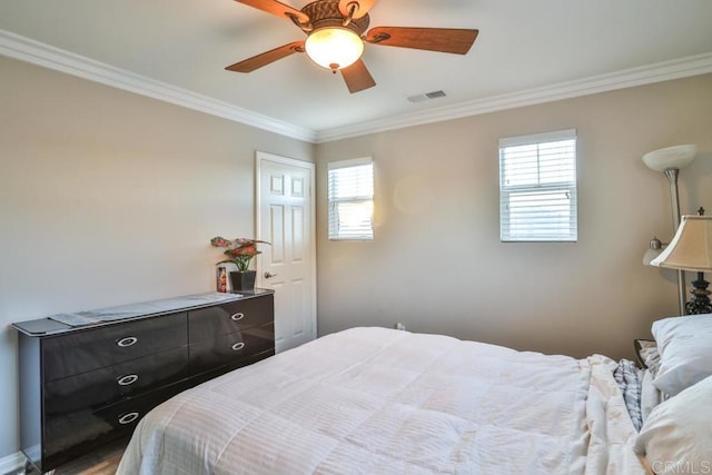 bedroom with crown molding, multiple windows, and ceiling fan
