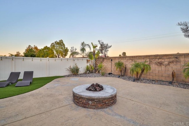 view of patio / terrace featuring a fenced backyard and an outdoor fire pit