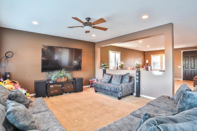 carpeted living room with a ceiling fan, recessed lighting, and baseboards