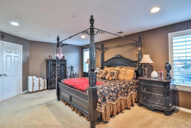 carpeted bedroom with recessed lighting and baseboards