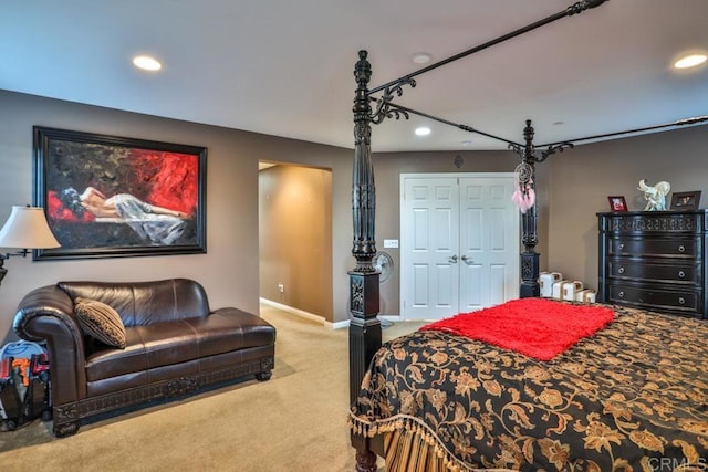 carpeted bedroom featuring recessed lighting, a closet, and baseboards