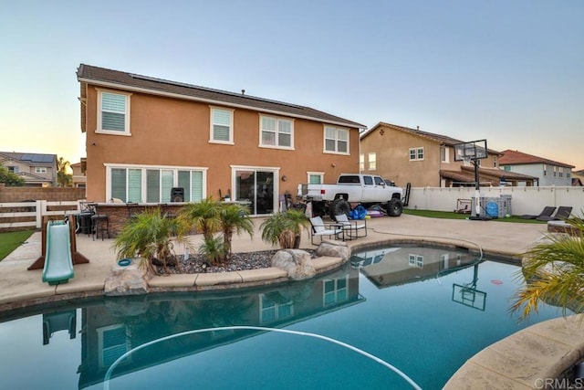view of pool with fence and a patio area