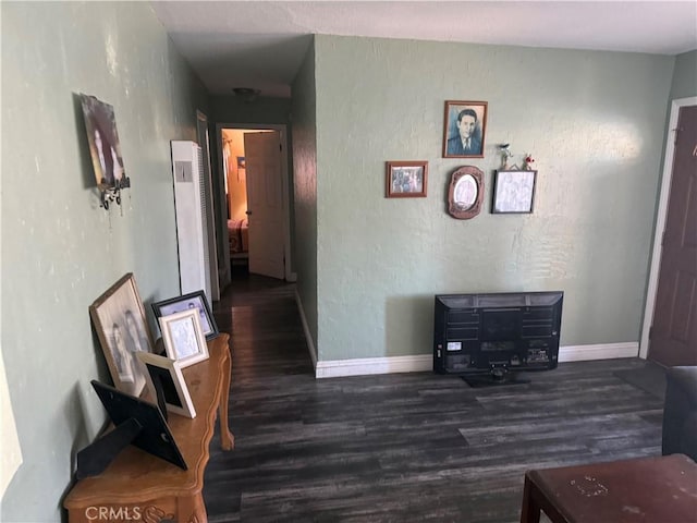 10146 Alpaca St, South El Monte, CA 91733 - corridor with wood finished floors, baseboards, and a textured wall