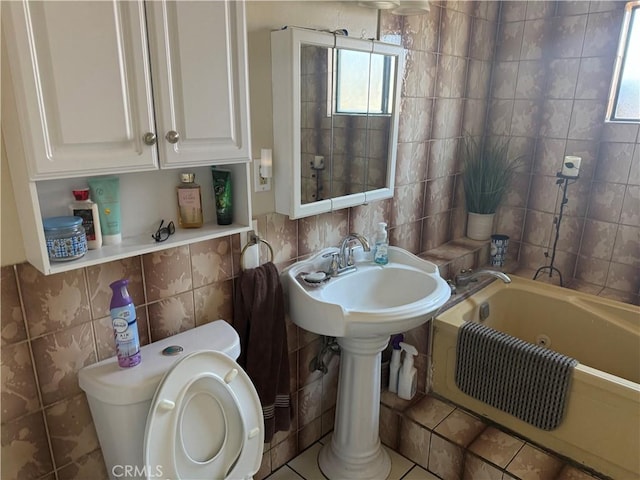 10146 Alpaca St, South El Monte, CA 91733 - full bath featuring tile walls, a bath, tile patterned flooring, and backsplash