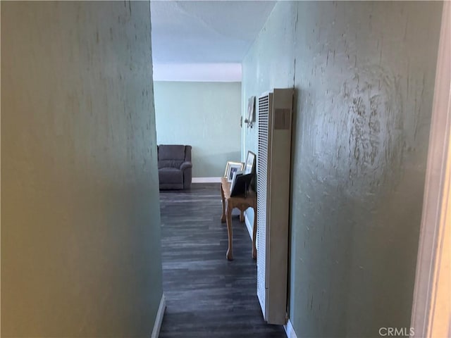 10146 Alpaca St, South El Monte, CA 91733 - hallway with dark wood-style floors, baseboards, and a heating unit
