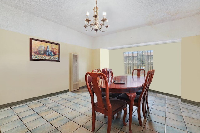1703 W 25th St, Los Angeles, CA 90018 - dining space featuring a chandelier, a textured ceiling, light tile patterned floors, and baseboards