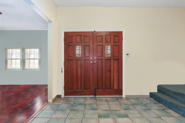 1703 W 25th St, Los Angeles, CA 90018 - entryway featuring stairway, baseboards, and wood finished floors
