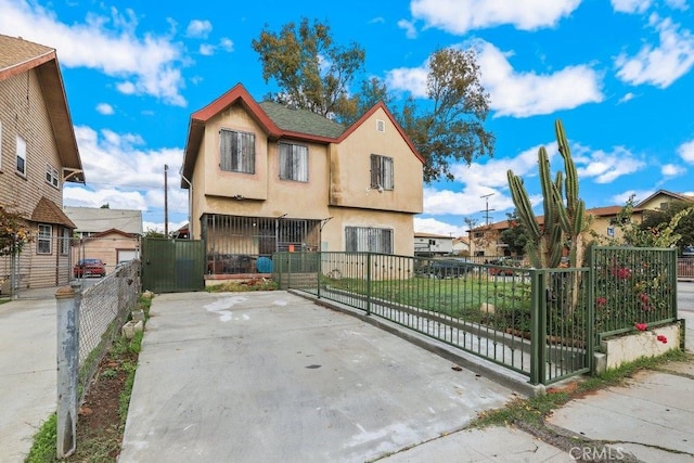 1703 W 25th St, Los Angeles, CA 90018 - townhome / multi-family property featuring stucco siding and a gate