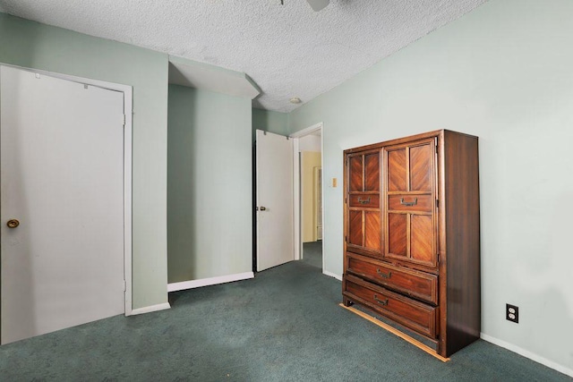1703 W 25th St, Los Angeles, CA 90018 - unfurnished bedroom featuring carpet floors, baseboards, and a textured ceiling