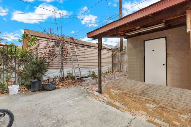 1703 W 25th St, Los Angeles, CA 90018 - view of patio / terrace featuring fence