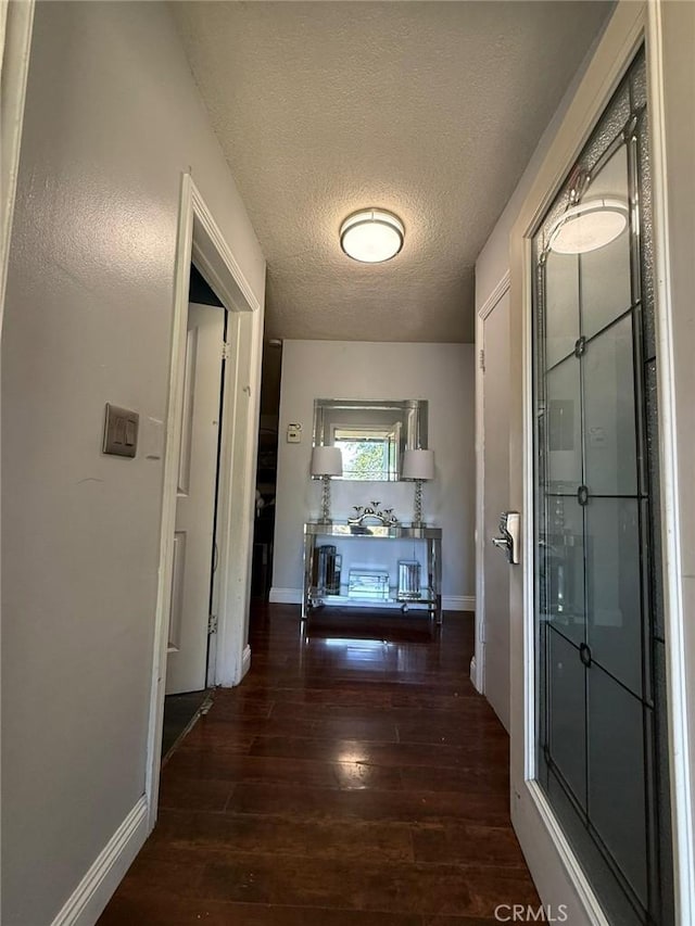 9617 Greenwood Ave, Montclair, CA 91763 - hallway with wood finished floors, a textured ceiling, and baseboards
