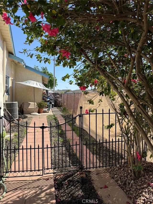 9617 Greenwood Ave, Montclair, CA 91763 - gate with cooling unit and a patio area