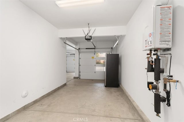 554 Catalonia, Lake Forest, CA 92630 - garage with water heater, a garage door opener, freestanding refrigerator, and baseboards