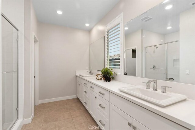 554 Catalonia, Lake Forest, CA 92630 - bathroom with double vanity, a stall shower, baseboards, recessed lighting, and tile patterned flooring