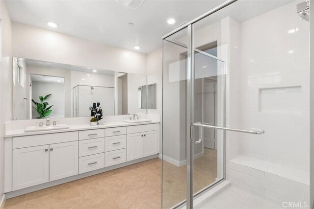 554 Catalonia, Lake Forest, CA 92630 - bathroom with a stall shower, double vanity, tile patterned floors, and recessed lighting