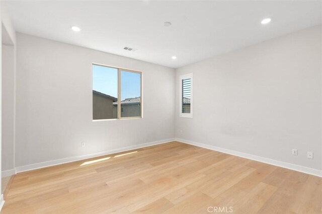 554 Catalonia, Lake Forest, CA 92630 - empty room with light wood finished floors, recessed lighting, and baseboards