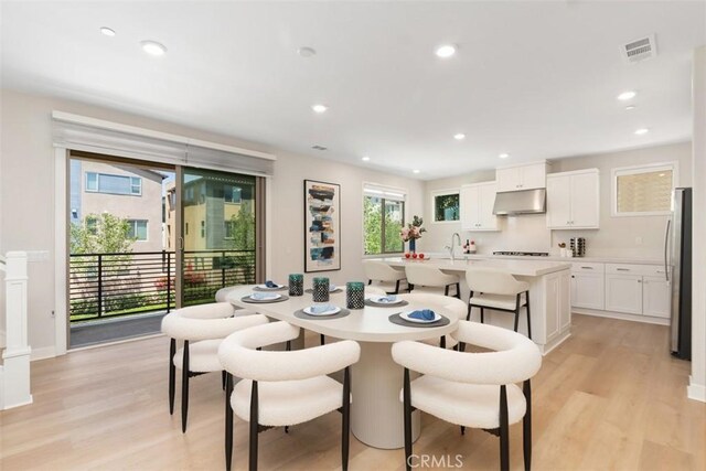 554 Catalonia, Lake Forest, CA 92630 - dining area featuring light wood-type flooring and recessed lighting