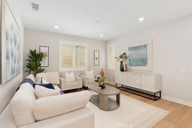 554 Catalonia, Lake Forest, CA 92630 - living room with light wood finished floors, baseboards, and recessed lighting