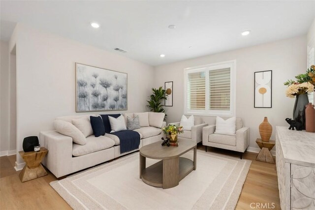 554 Catalonia, Lake Forest, CA 92630 - living area featuring light wood-type flooring, baseboards, and recessed lighting