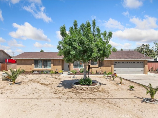 8149 Langdon Ave, Hesperia, CA 92345 - view of front facade with stucco siding, an attached garage, driveway, and fence
