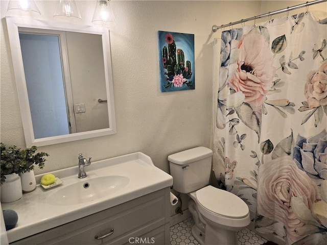 8149 Langdon Ave, Hesperia, CA 92345 - full bath featuring toilet, vanity, tile patterned floors, and a shower with curtain