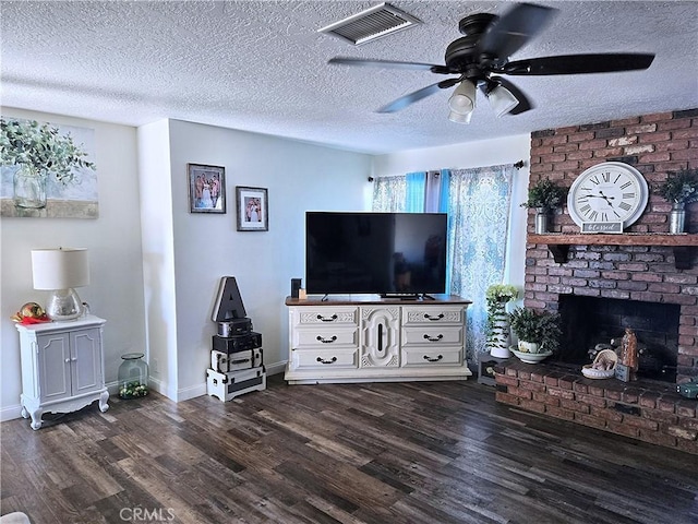 8149 Langdon Ave, Hesperia, CA 92345 - living area with dark wood finished floors, ceiling fan, baseboards, a textured ceiling, and a fireplace