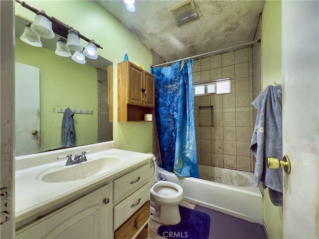 full bathroom with shower / bath combo with shower curtain, vanity, and toilet