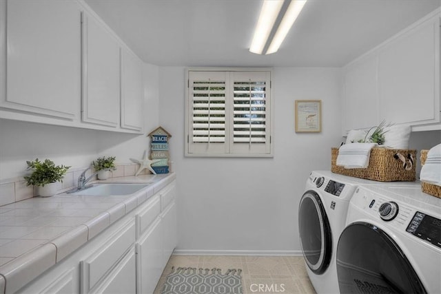 1467 18th St, Manhattan Beach, CA 90266 - laundry area featuring washing machine and dryer, cabinet space, and baseboards