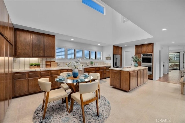 1467 18th St, Manhattan Beach, CA 90266 - kitchen with appliances with stainless steel finishes, healthy amount of natural light, backsplash, and recessed lighting