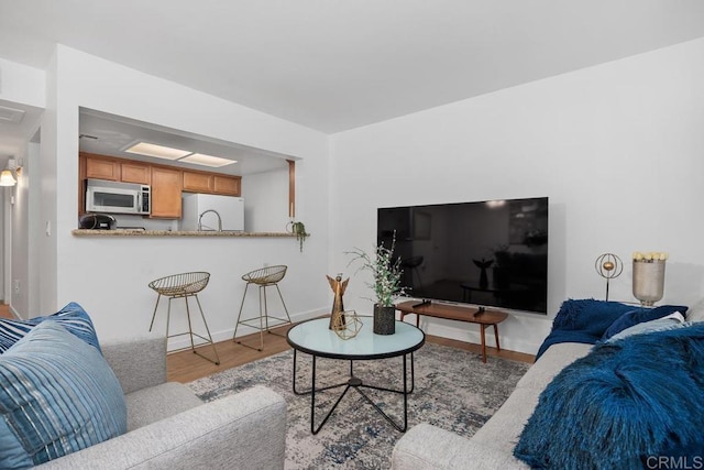 15048 Avenida Venusto Unit 255, San Diego, CA 92128 - living area featuring wood finished floors and baseboards