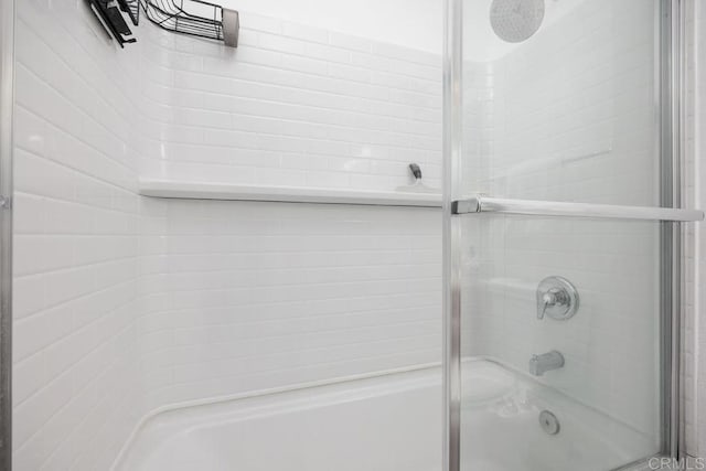 15048 Avenida Venusto Unit 255, San Diego, CA 92128 - bathroom featuring shower / bath combination with glass door