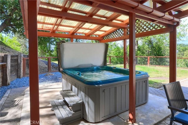 45792 Sutton Dr, Oakhurst, CA 93644 - view of patio / terrace with a hot tub and a fenced backyard