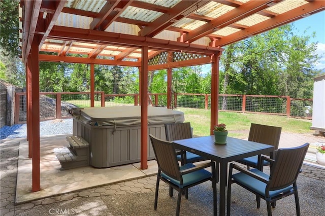 45792 Sutton Dr, Oakhurst, CA 93644 - sunroom featuring a hot tub, outdoor dining space, and view of wooded area