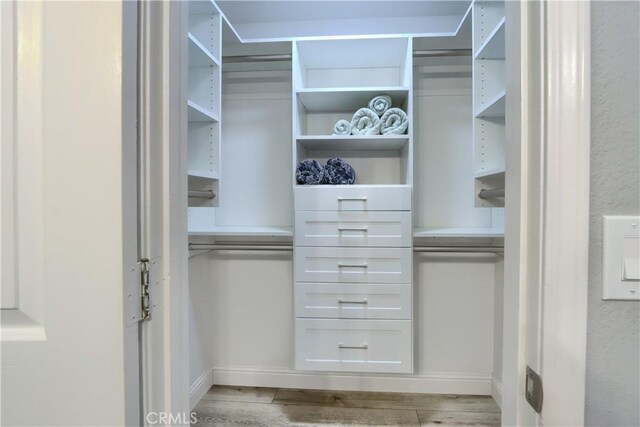 45792 Sutton Dr, Oakhurst, CA 93644 - walk in closet with light wood-style floors
