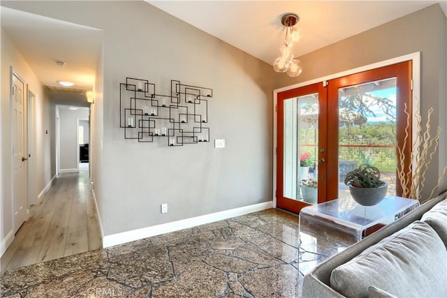 45792 Sutton Dr, Oakhurst, CA 93644 - doorway with baseboards and a chandelier
