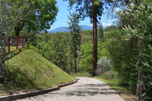 45792 Sutton Dr, Oakhurst, CA 93644 - surrounding community featuring a mountain view and a view of trees